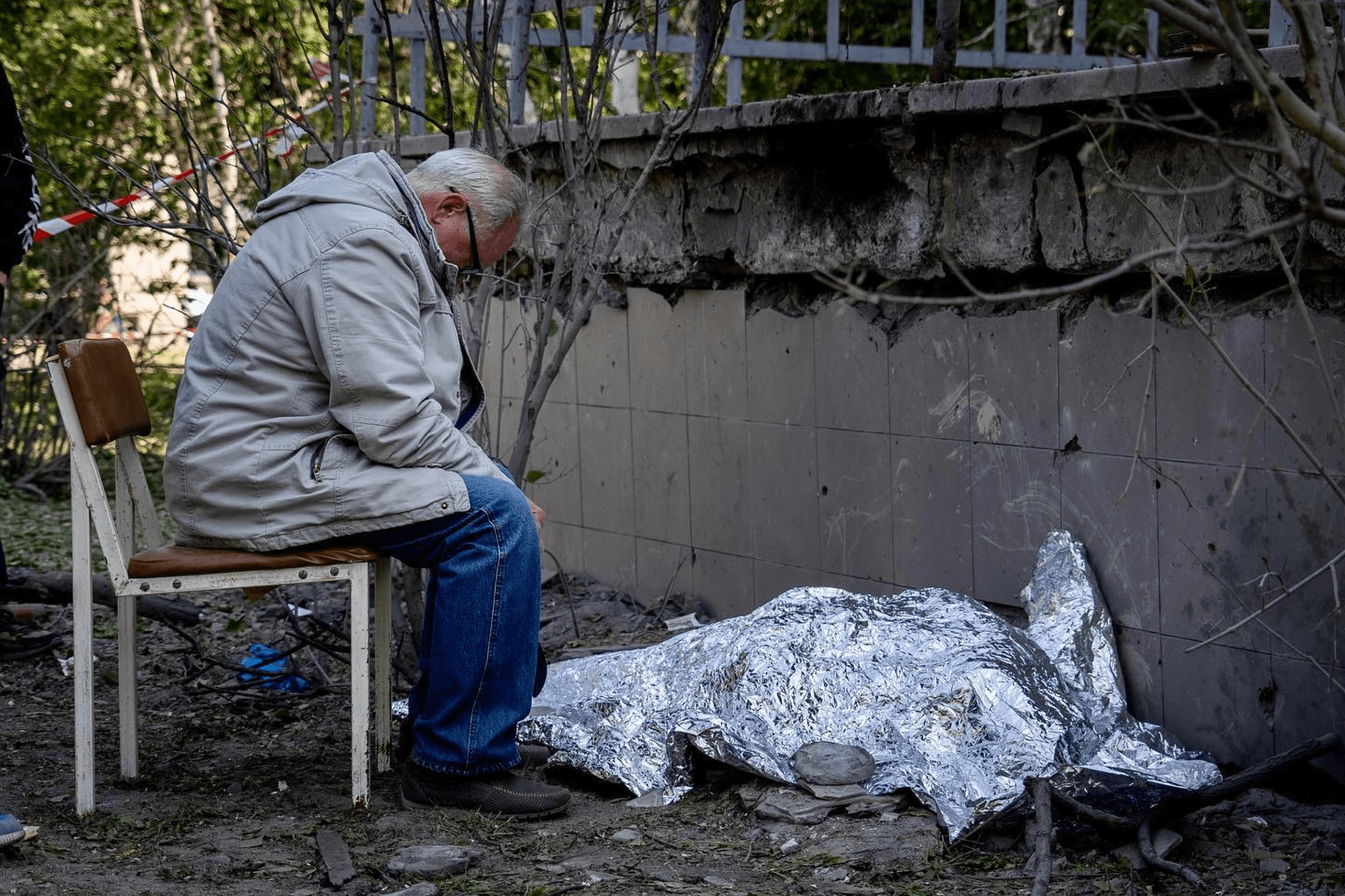 A grandfather mourns his grandson killed in a Russian strike on Kyiv, Ukraine. At least three people were killed in the attack, including a 9-year-old girl and her mother. June 2023.