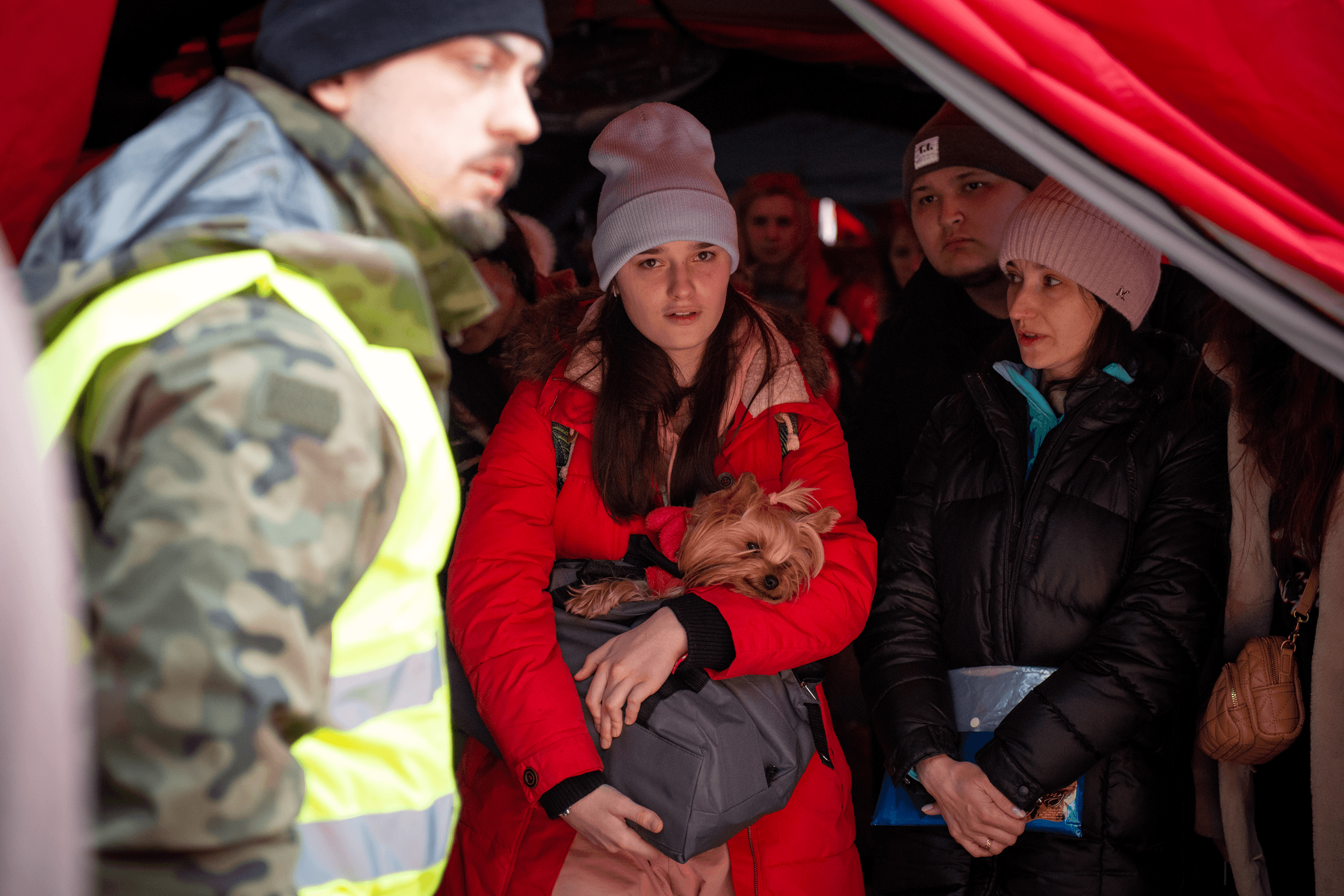 A Ukrainian refugee with her dog at a refugee reception center in Korczowa, Poland. March 12, 2022.