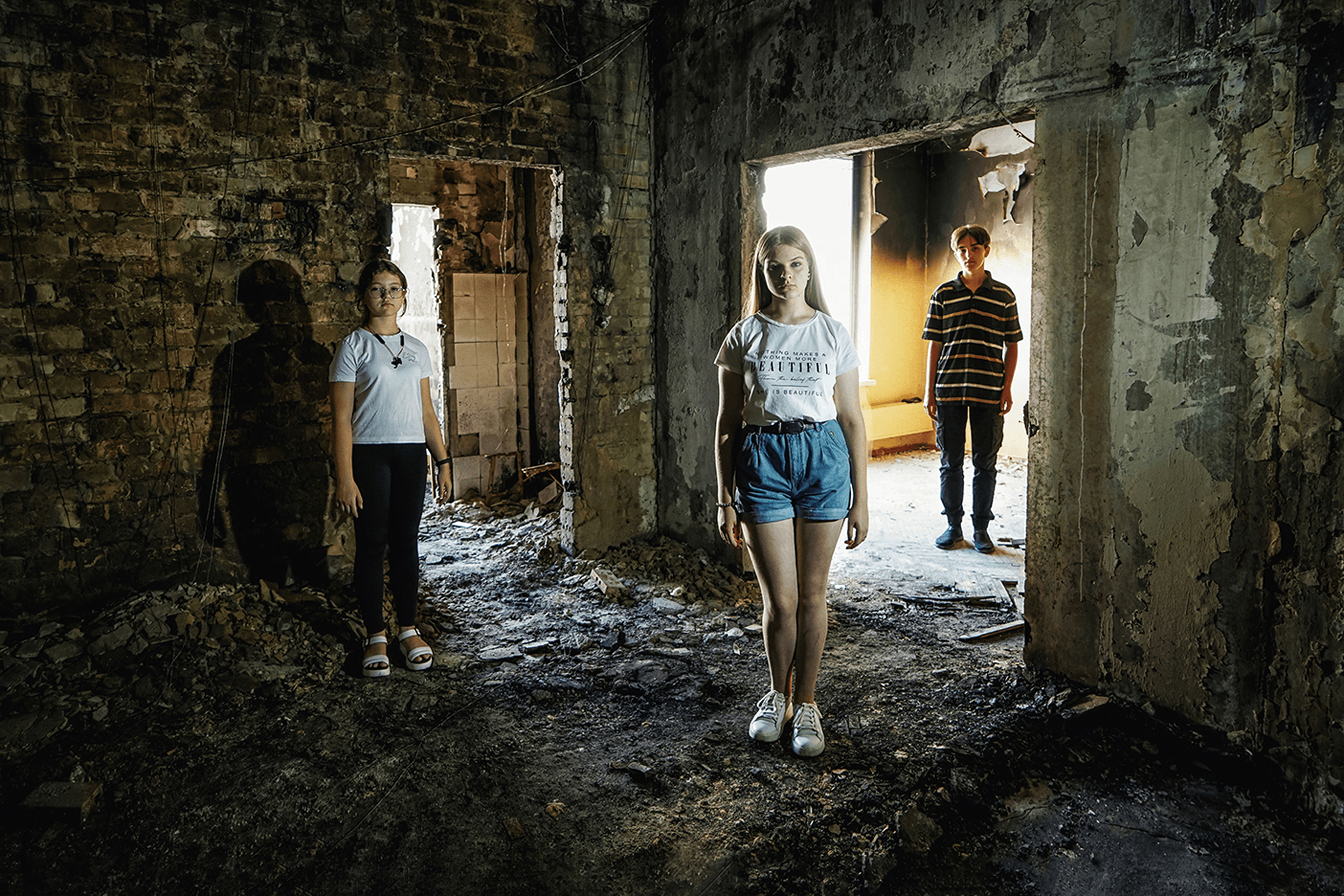 High school students in a destroyed school. Irpin, Ukraine. Summer 2022.