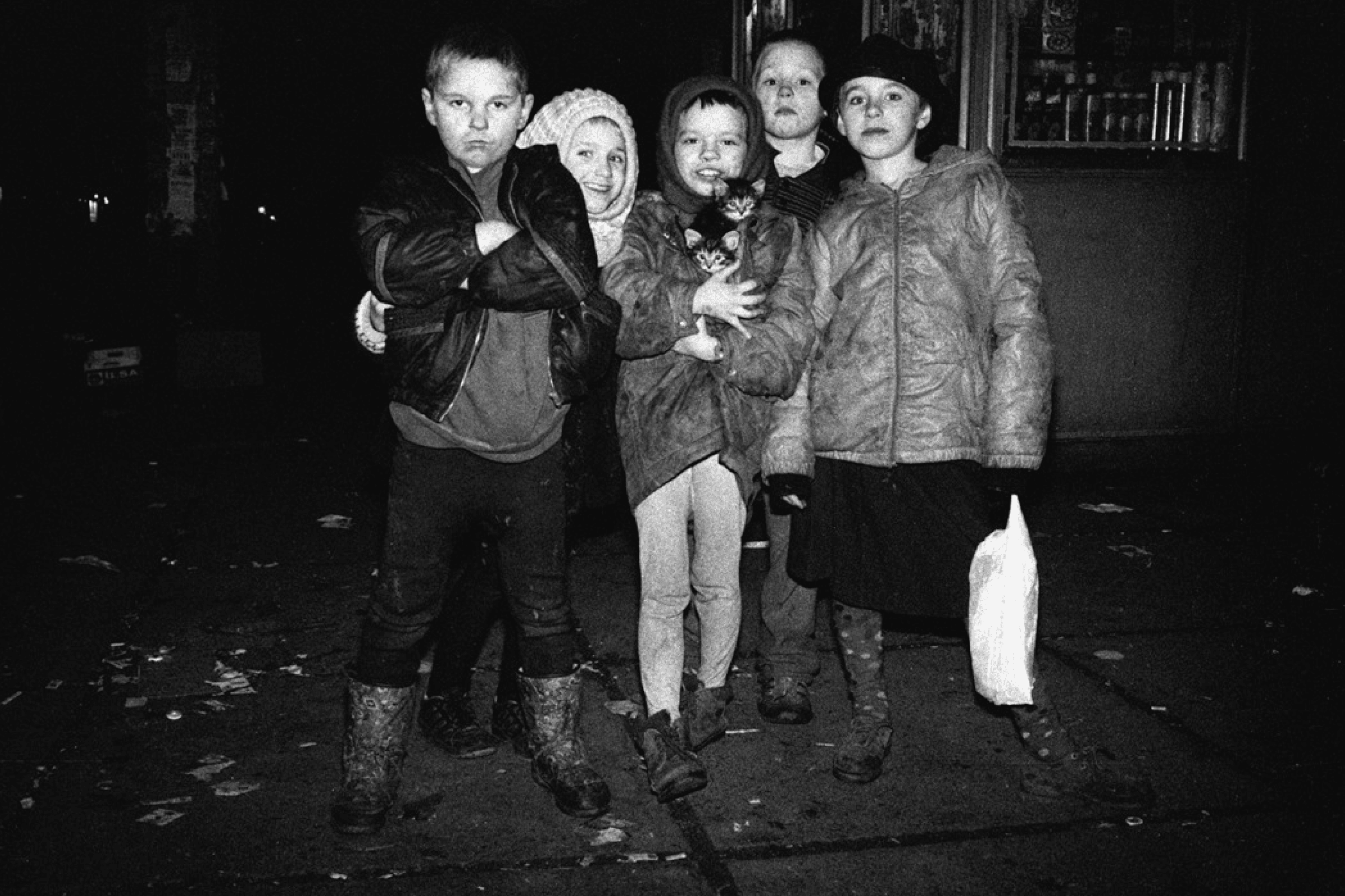 Group photo of homeless children who, late at night, asked to be photographed the way they wanted. Oleksandr Glyadyelov printed five copies of the picture and, two days later, gave one to each of them. “Only two days have passed, and you’re no longer with me,” said Vitya, looking at the photo — he was talking about his girlfriend. Pochaina metro station, Kyiv, Ukraine. 1996.