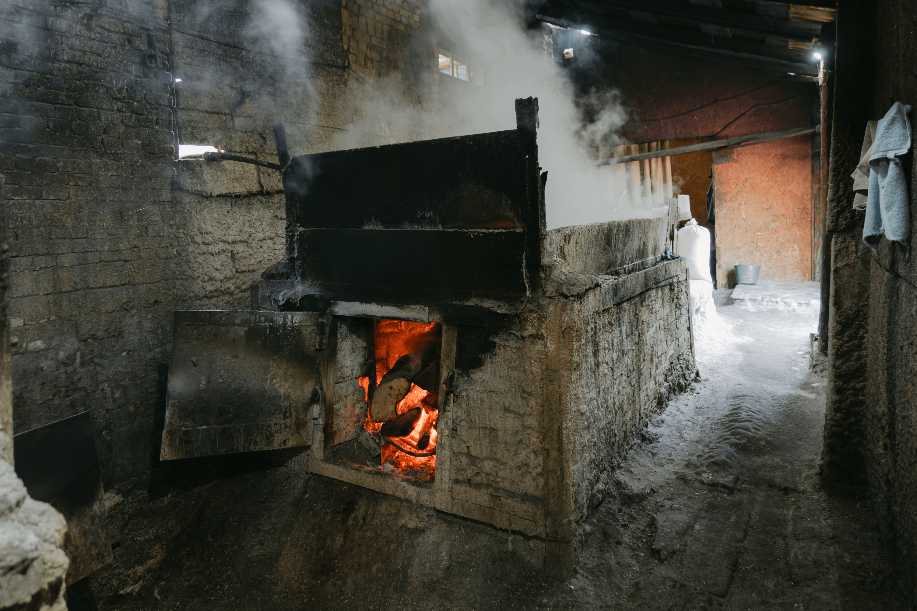 The evaporation pan, where salt is boiled from brine over a wood fire.