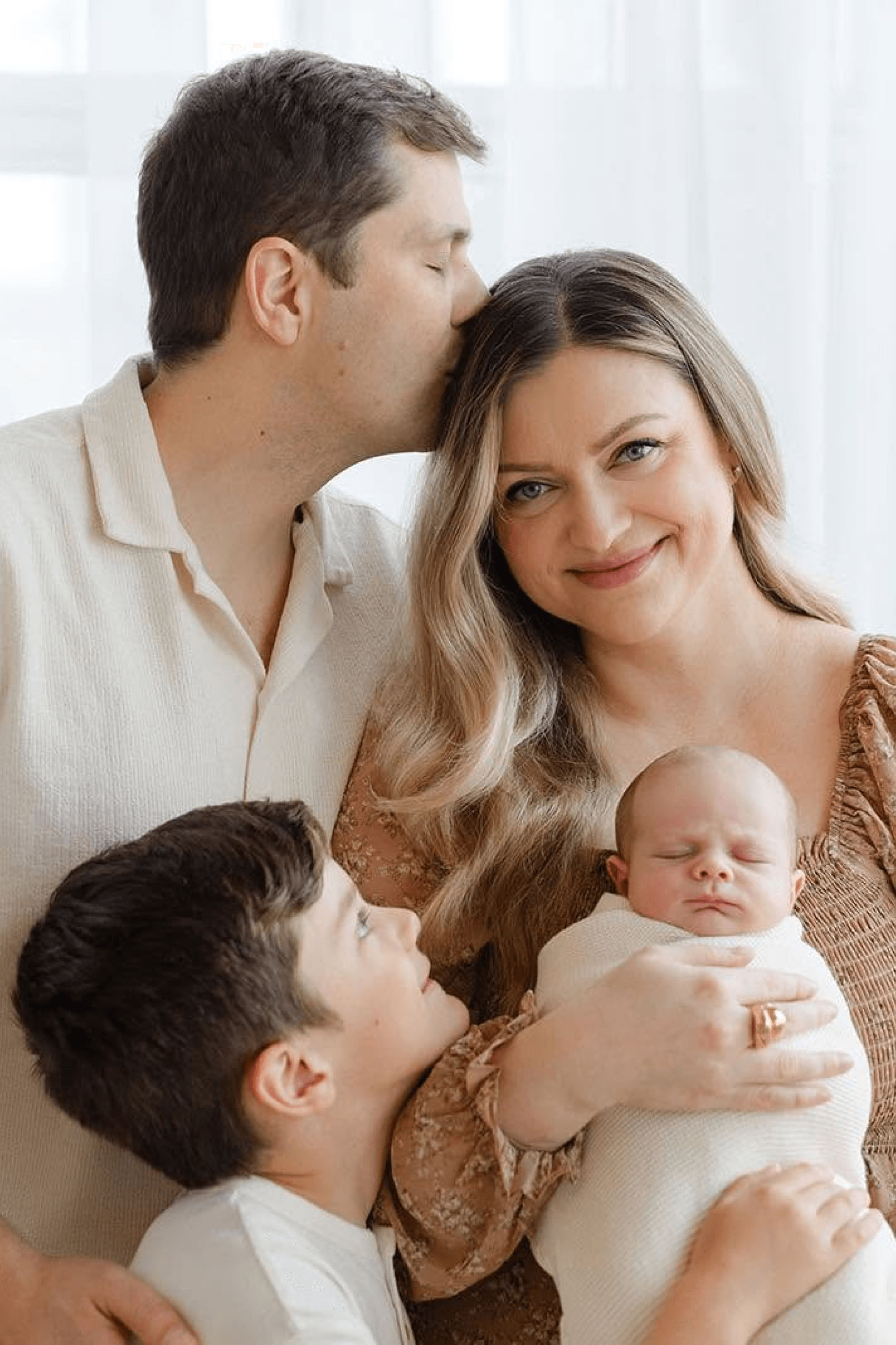 Iryna Kisil with her husband and children.