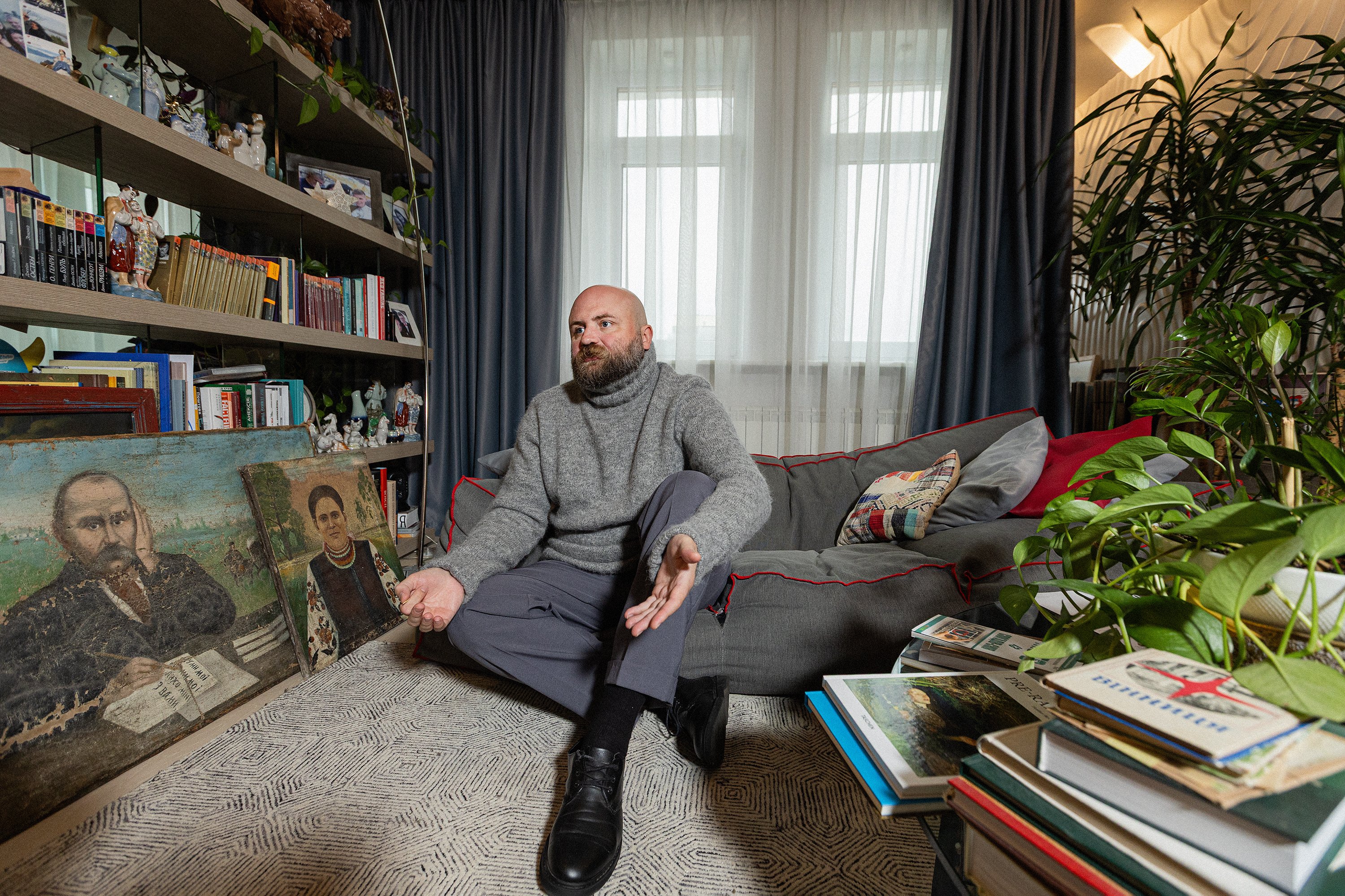 In his living room, Leonid keeps hundreds of books on Ukrainian art and items from his private collection.