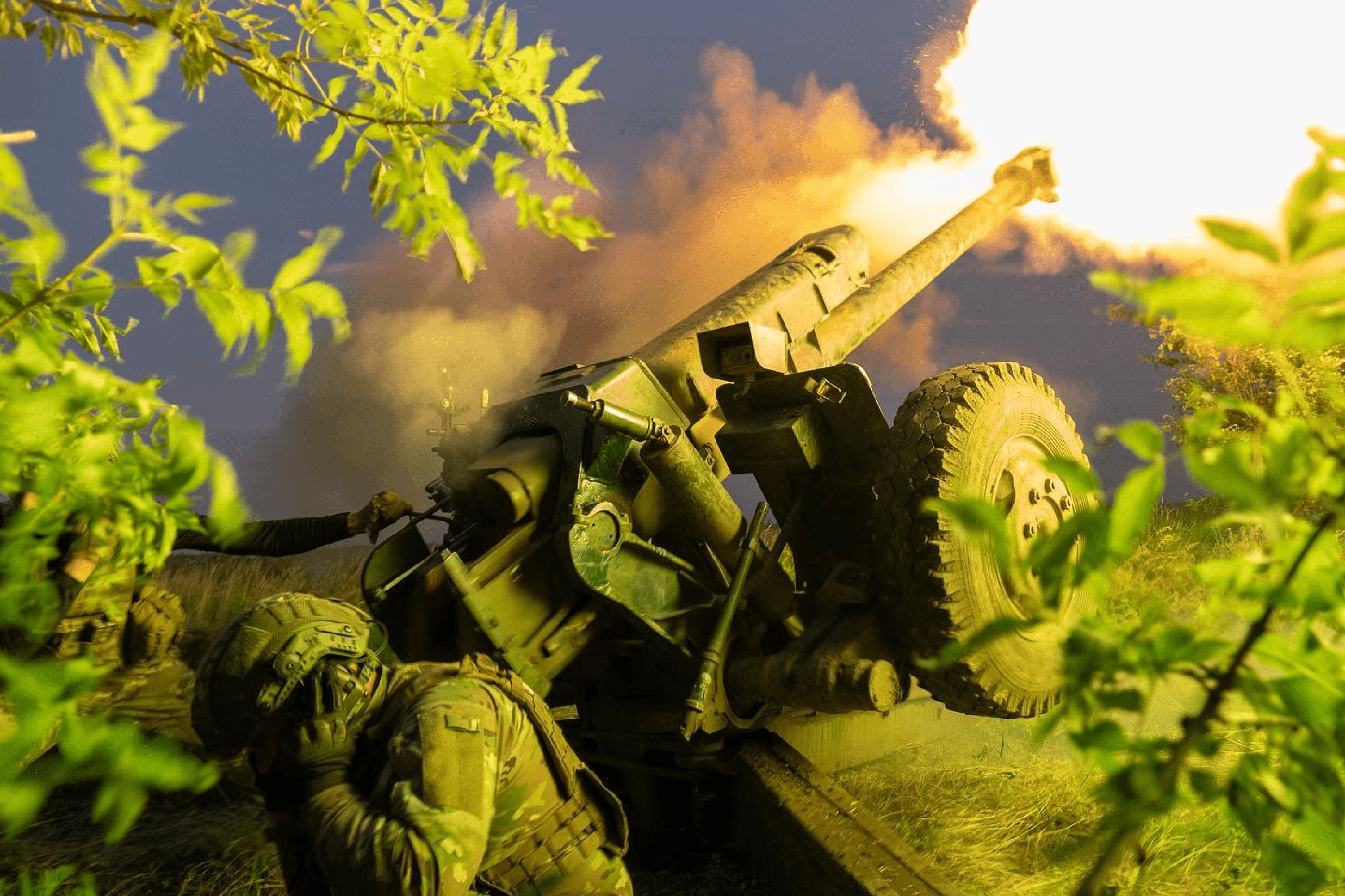 Ukrainian soldiers fire a 122mm D-30 howitzer at Russian positions in Kherson region, Ukraine. June 2023.