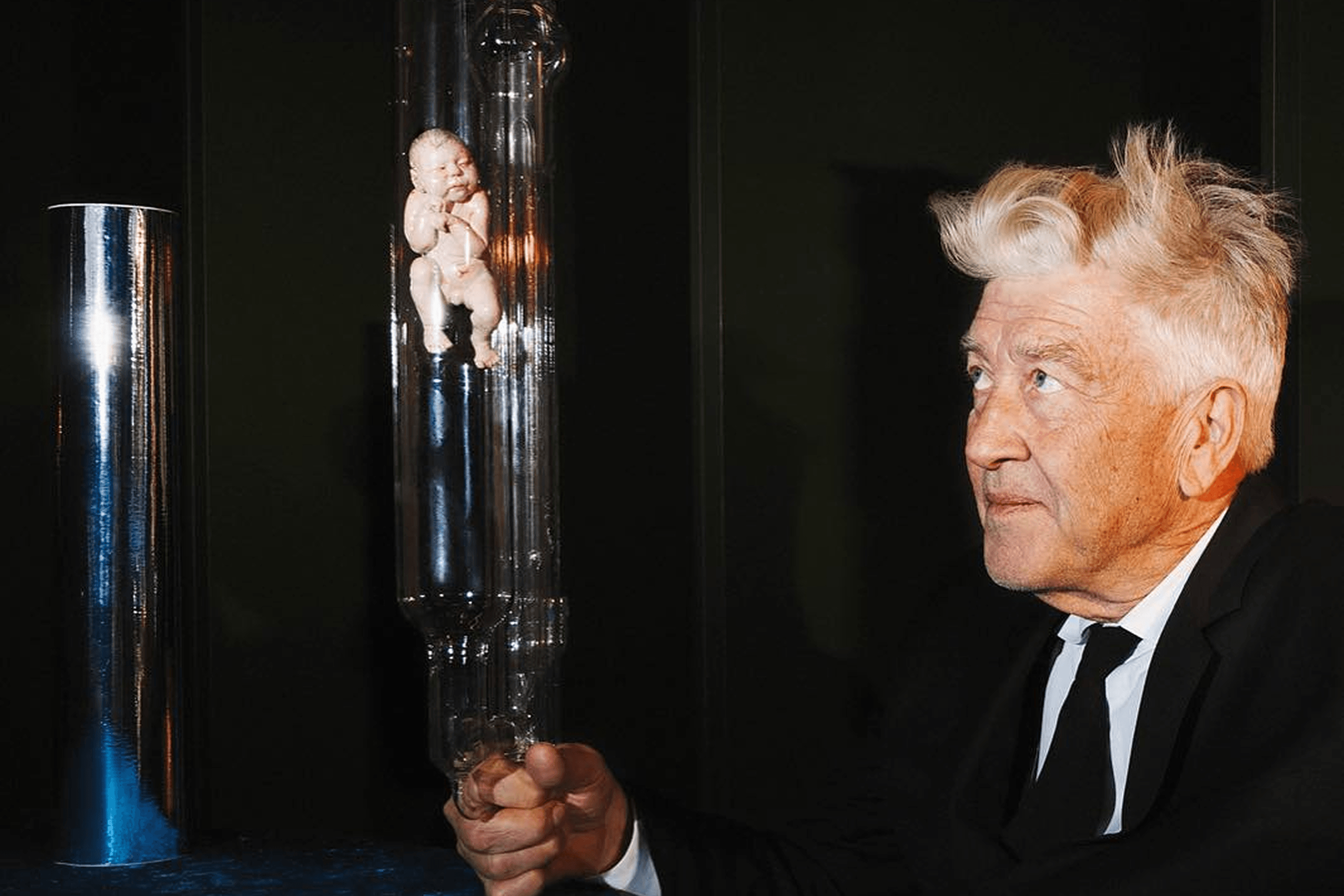 Portrait of director David Lynch holding a handmade embryo symbolizing the photographer’s personal experiences. 2017.