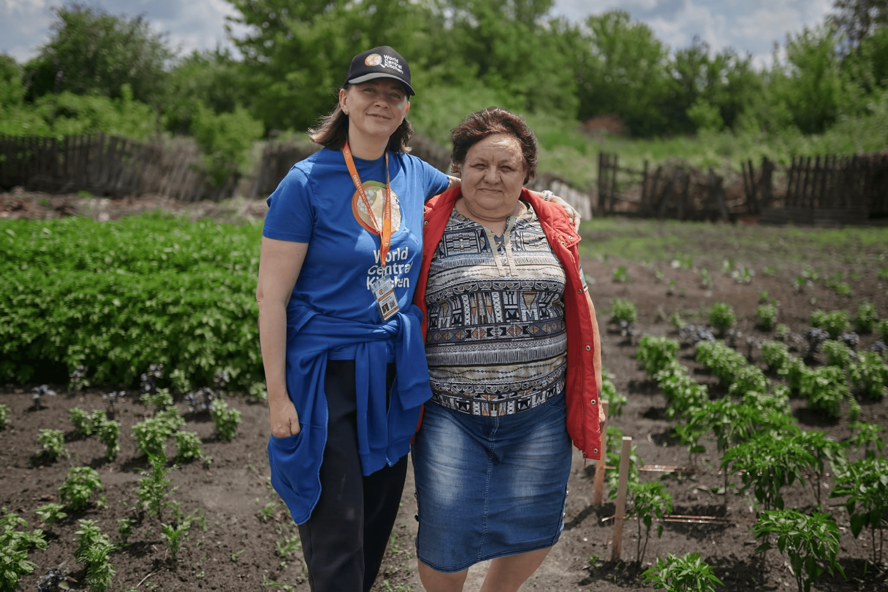 Halyna, a resident of Studenok, grows vegetables and herbs from seeds provided by World Central Kitchen. July 2025.