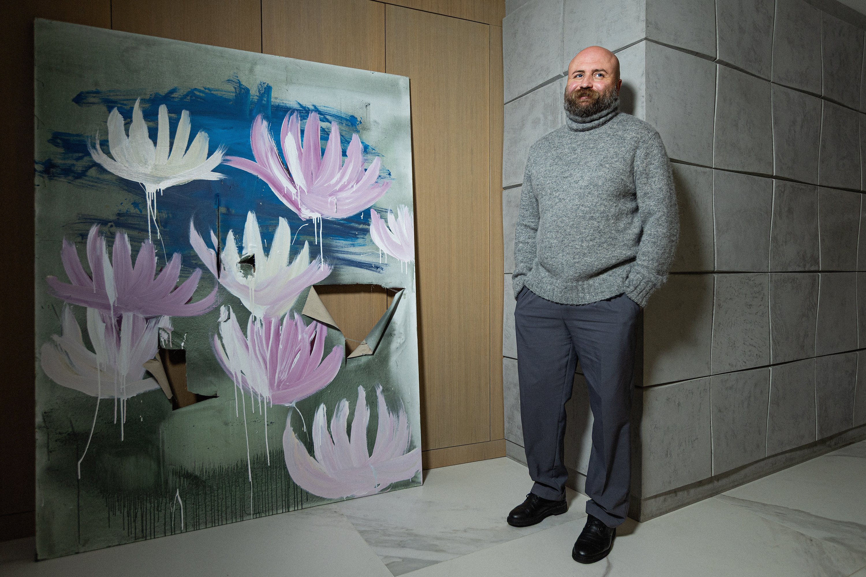 A painting by contemporary Ukrainian artist Roma Mykhailov in Leonid’s hallway. The damage on the image of gas burners is part of the artist’s concept.