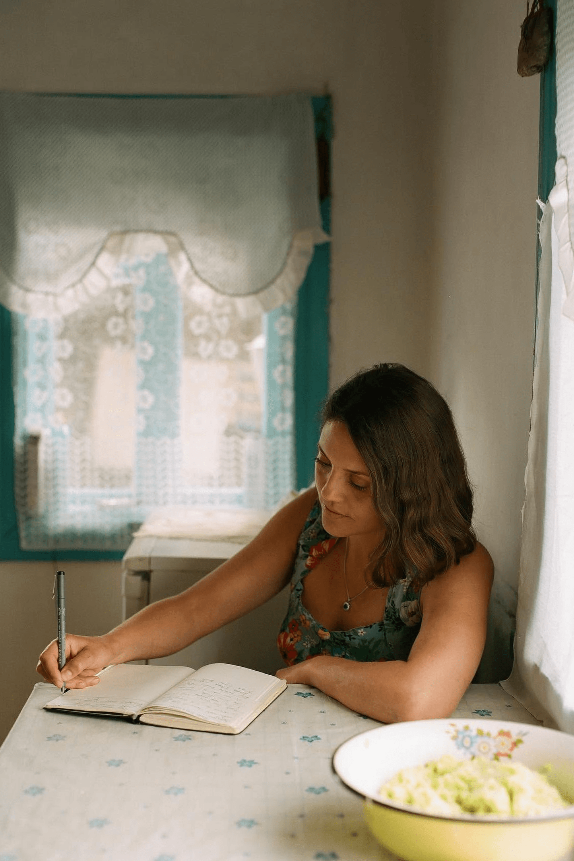 Olia Hercules writing the introduction to Summer Kitchens near the Ukrainian–Belarusian border.