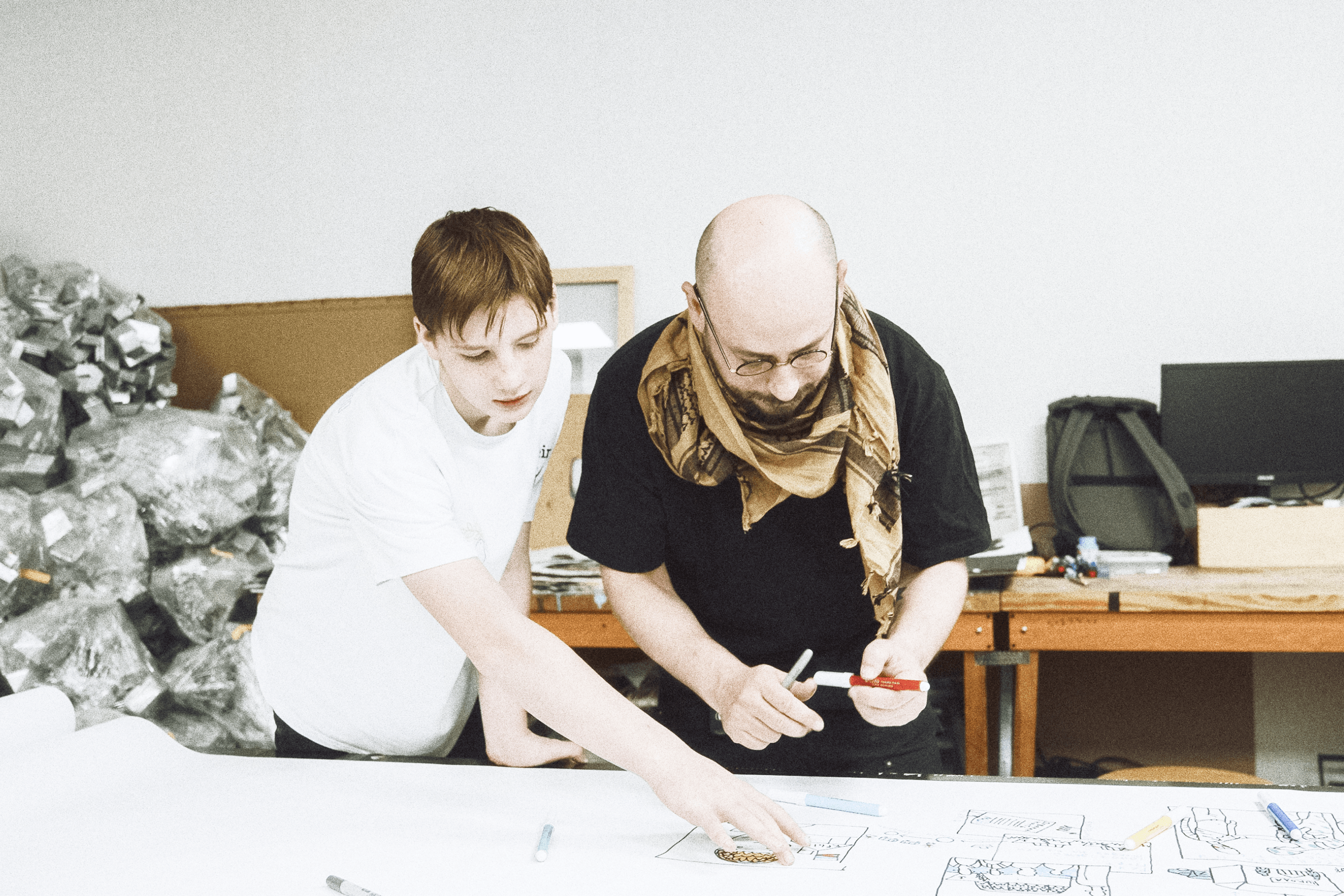 Kyrylo working with Oleksii Sai.