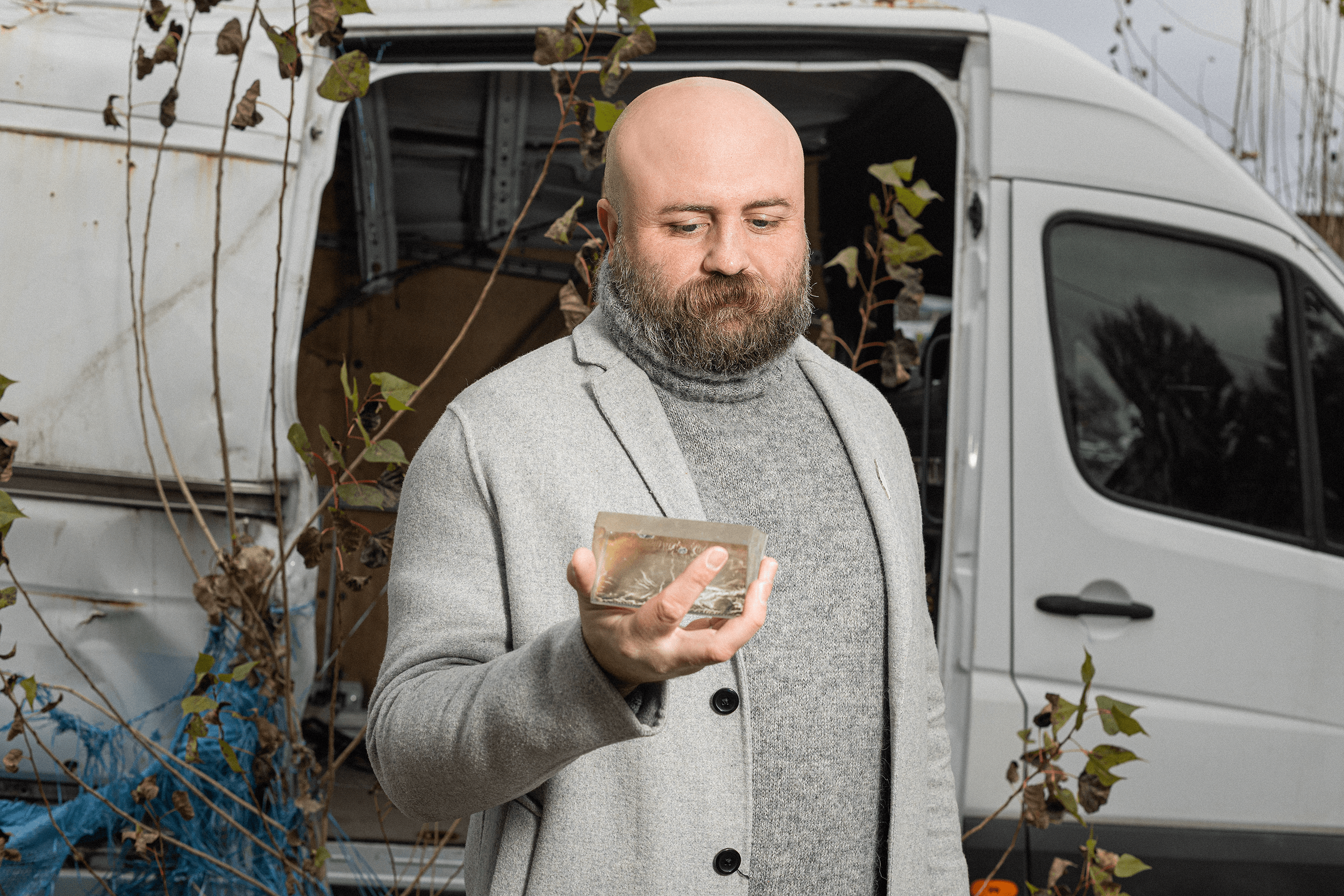 Leonid holds a tank viewing lens, part of its optical system. He found it in a village in the Kherson region.