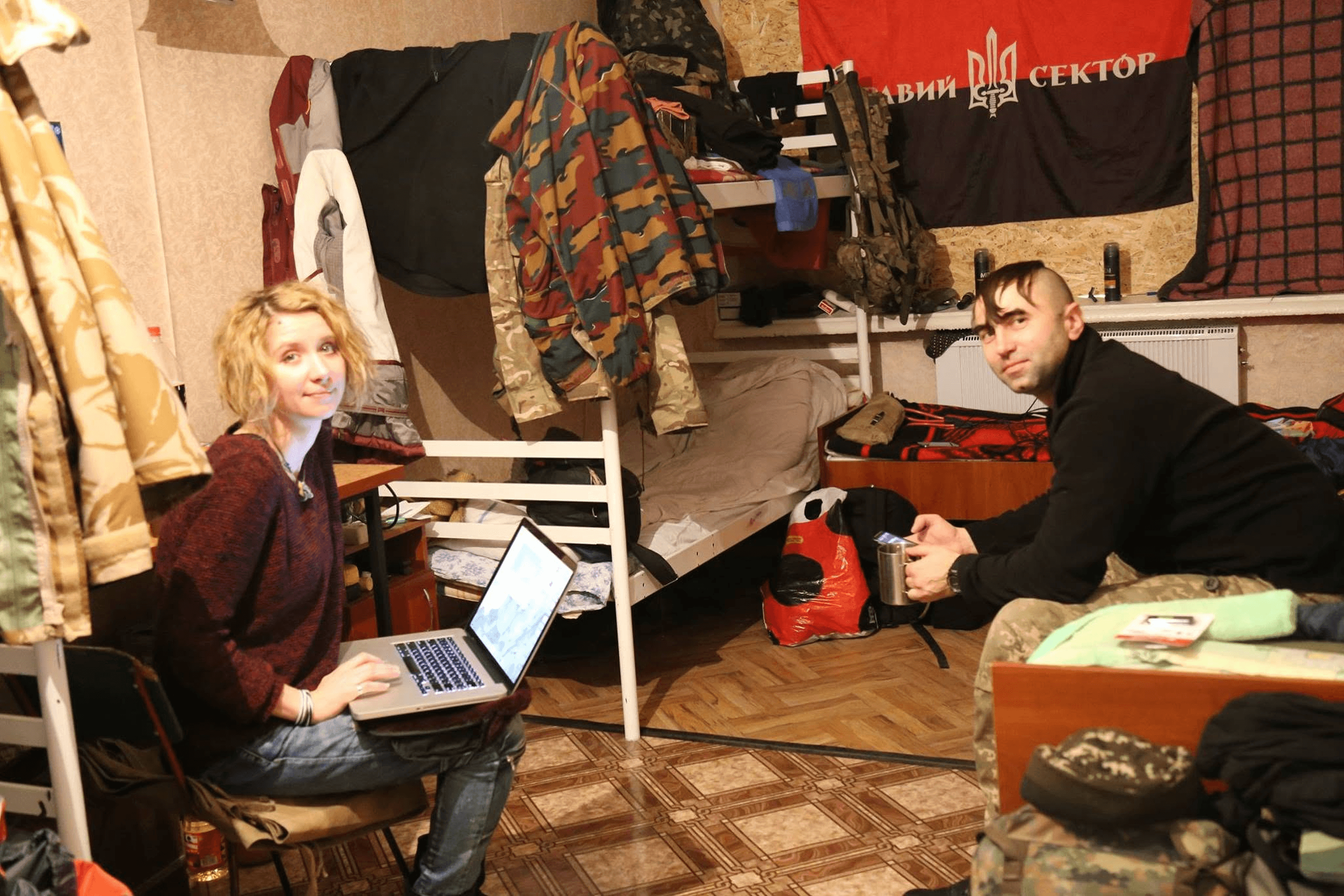 Alisa Kovalenko with DUK fighters, the subjects of her documentary film “Alisa in Warland,” after a screening in Velykomykhailivka, Dnipropetrovsk Oblast. January 2016.