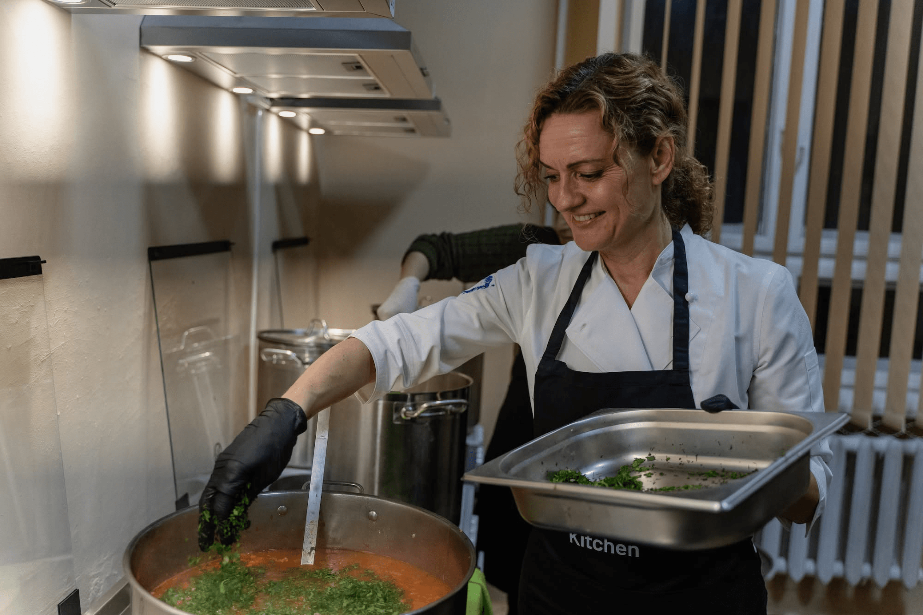 Chef Polina leads a cooking class for shelter residents at a World Central Kitchen community kitchen in Lviv. December 12, 2024.